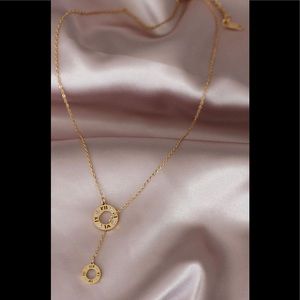 Women's gold steel necklace with zircon gemstones.